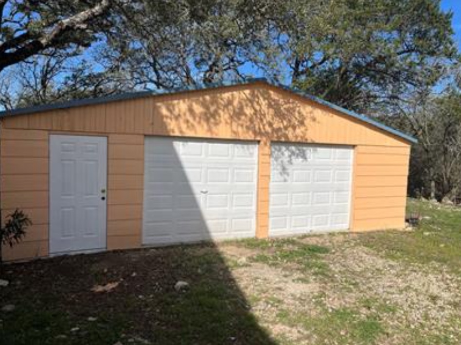 230 Six Pines Road San Marcos, TX 78666 - Photo 16 of 21 a view of a house with a backyard
