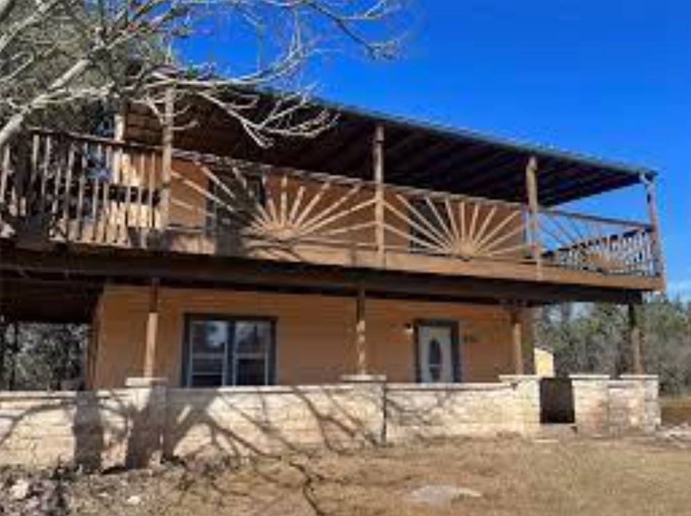 230 Six Pines Road San Marcos, TX 78666 - Photo 2 of 21 a view of a house with a wooden bench
