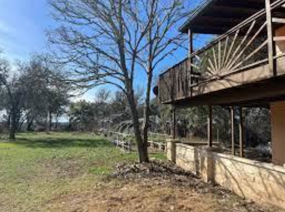 230 Six Pines Road San Marcos, TX 78666 - Photo 4 of 21 a view of a house with a yard