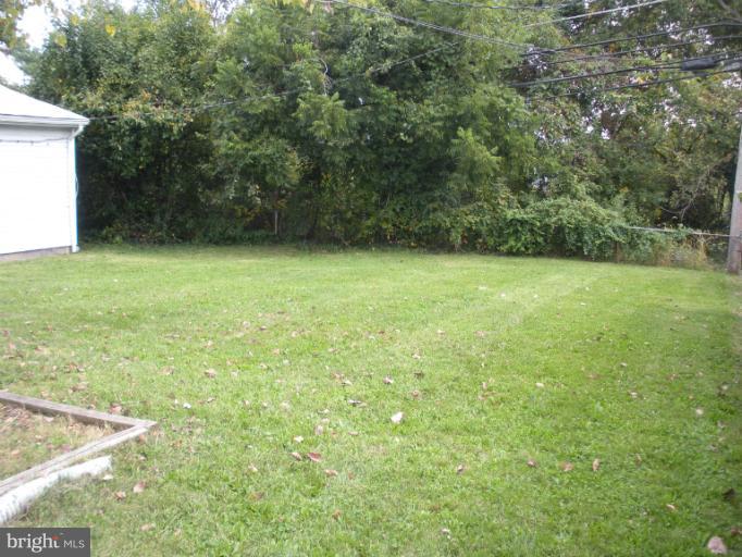 1806 Colmar Road Gwynn Oak, MD 21207 - Photo 1 of 14 rear yard backing to trees
