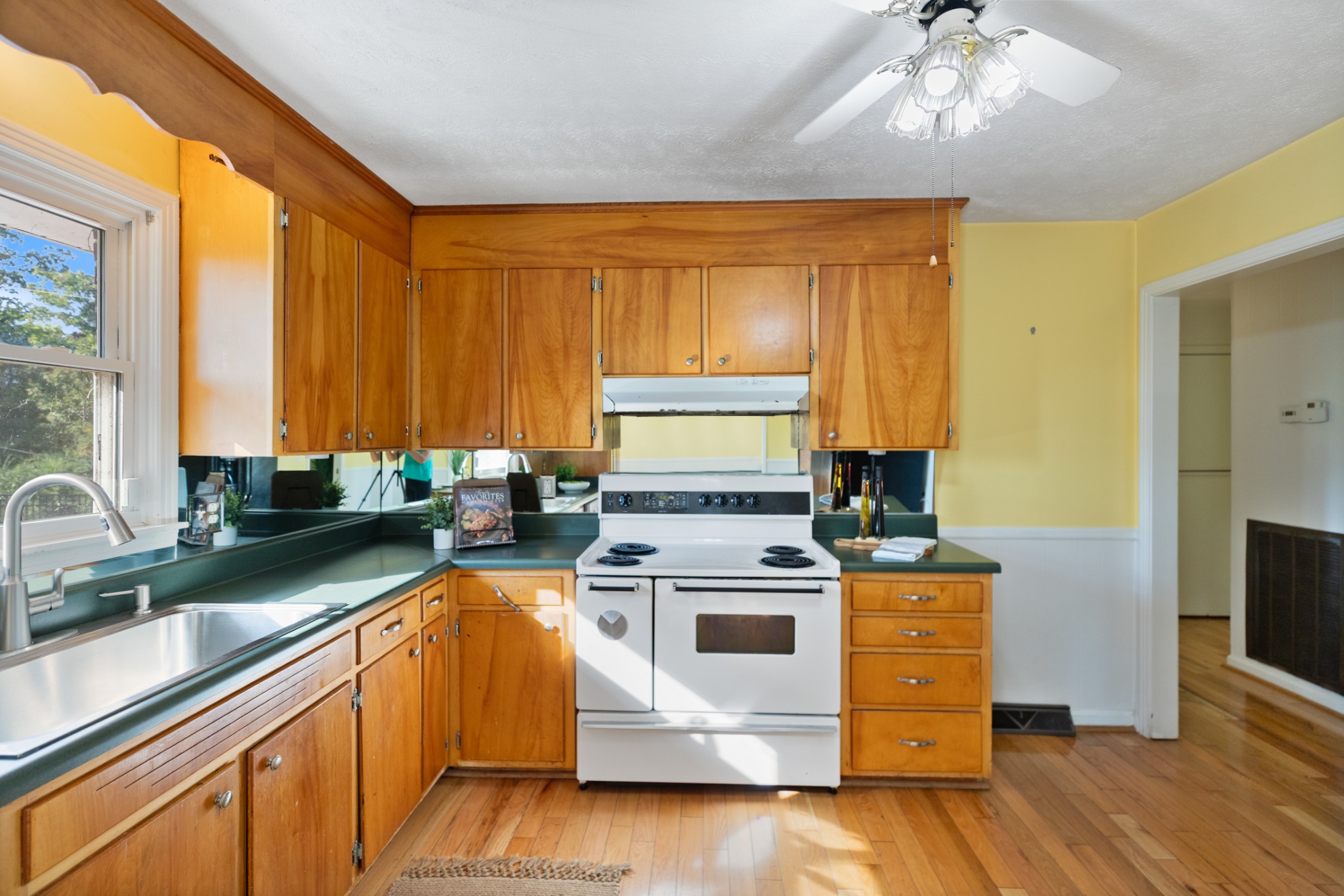 1380 Cowan Road Dickson, TN 37055 - Photo 24 of 61 a kitchen with a stove a sink and cabinets