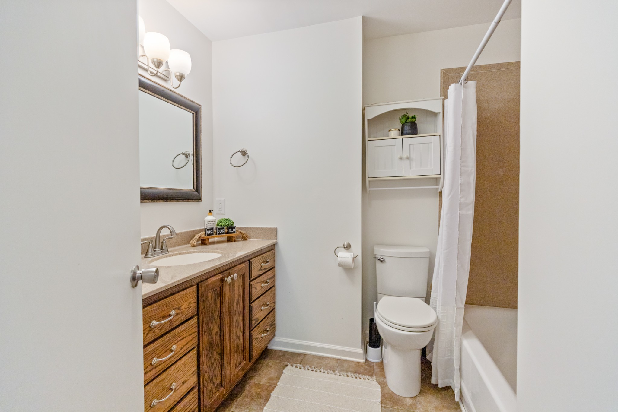 1380 Cowan Road Dickson, TN 37055 - Photo 28 of 61 a bathroom with a toilet sink and mirror