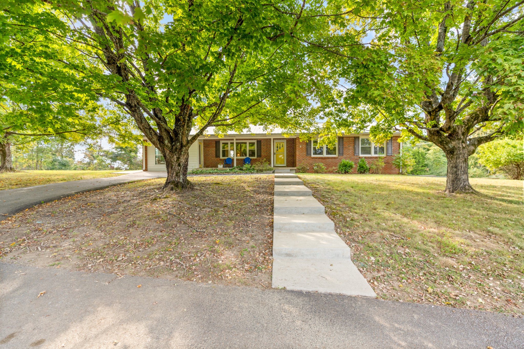 1380 Cowan Road Dickson, TN 37055 - Photo 4 of 61 a front view of a house with a yard and trees