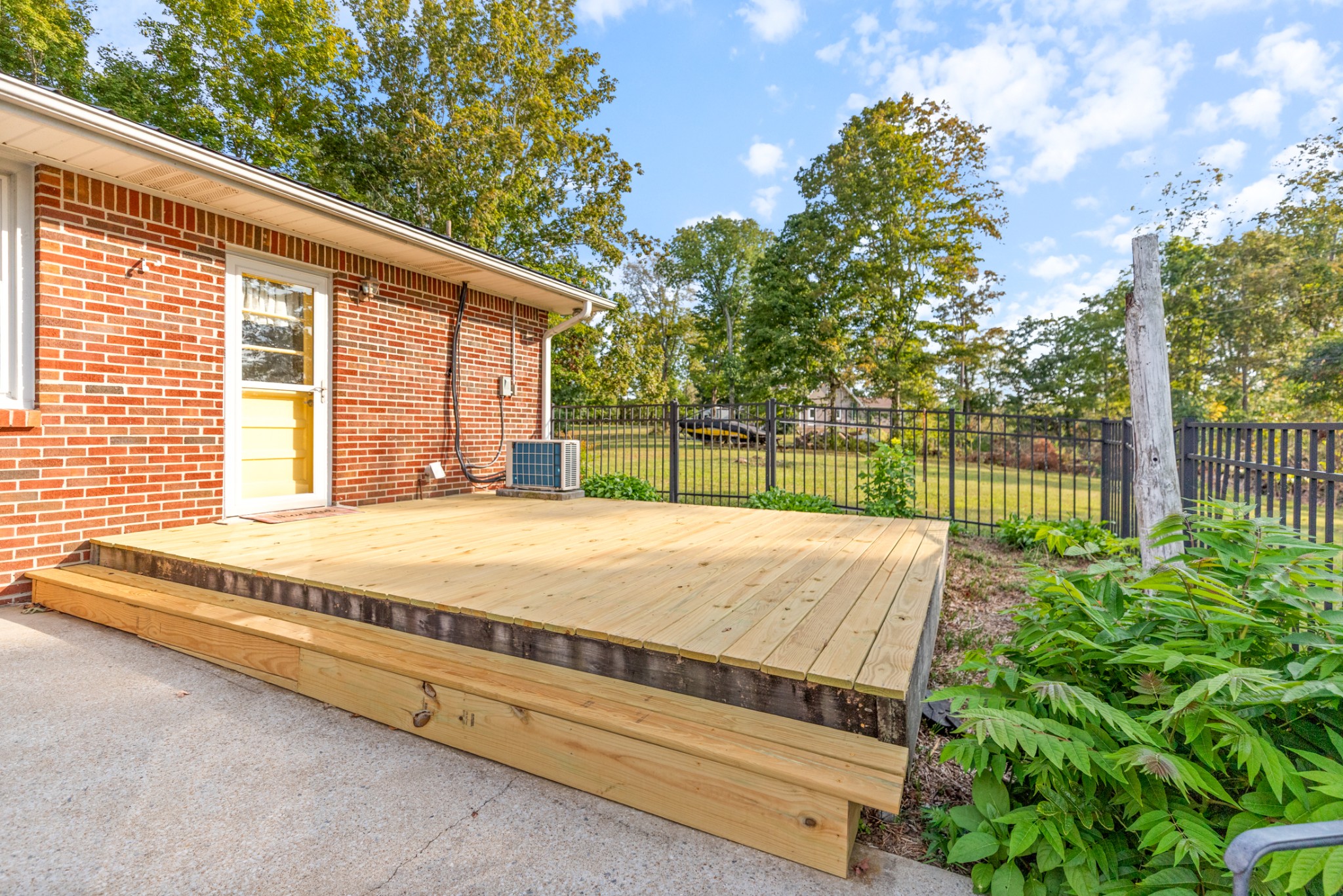 1380 Cowan Road Dickson, TN 37055 - Photo 45 of 61 a view of a backyard with a garden and deck