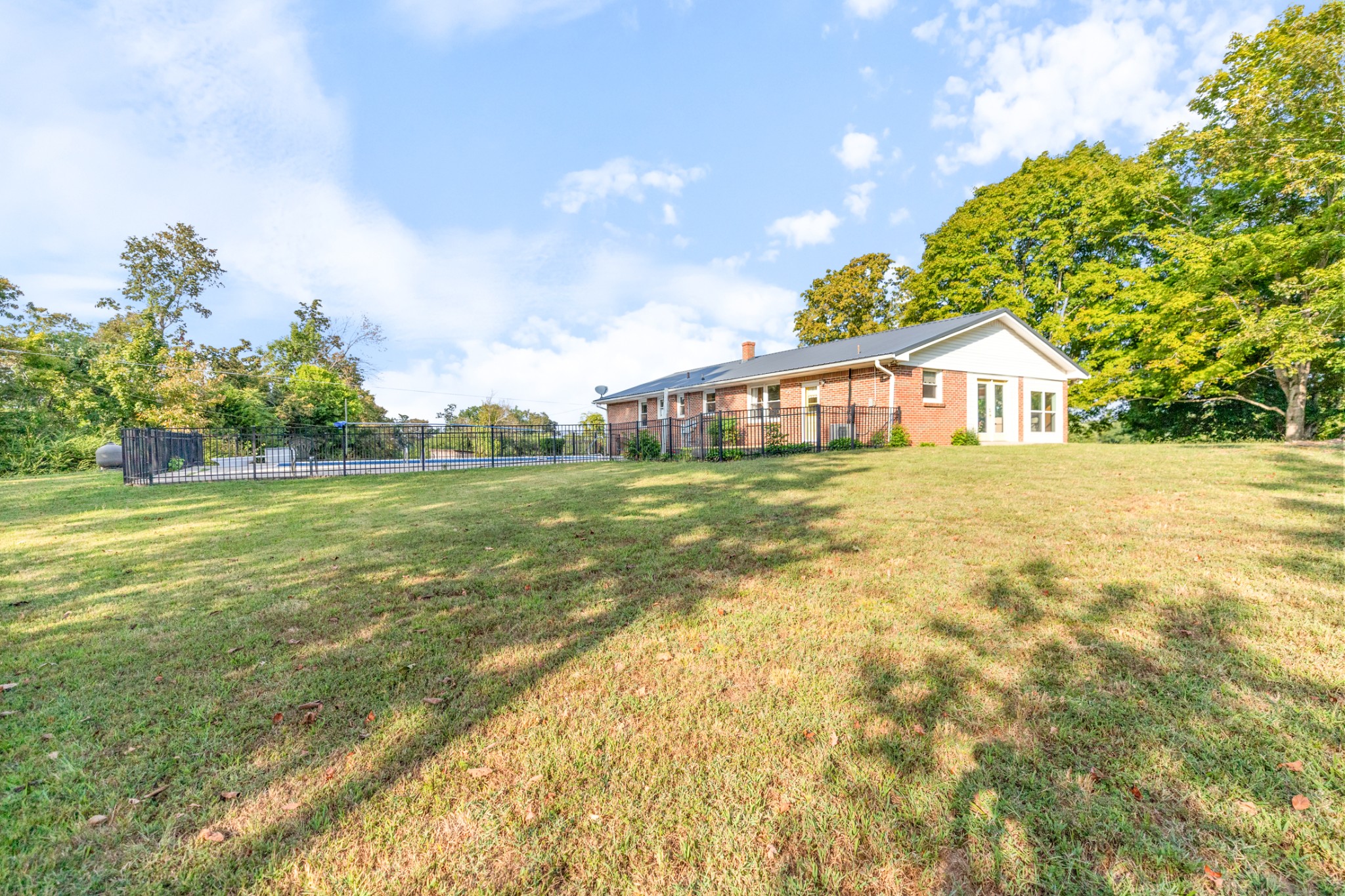 1380 Cowan Road Dickson, TN 37055 - Photo 46 of 61 a view of a house with a big yard and potted plants