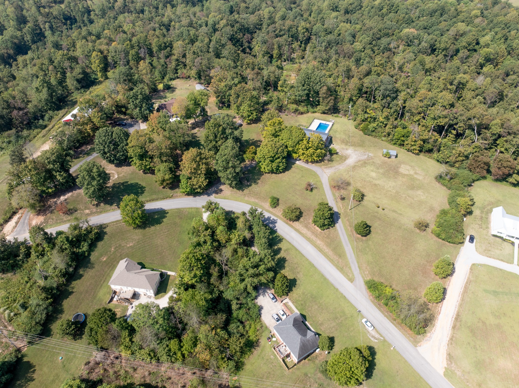 1380 Cowan Road Dickson, TN 37055 - Photo 48 of 61 an aerial view of a house with a yard and lake