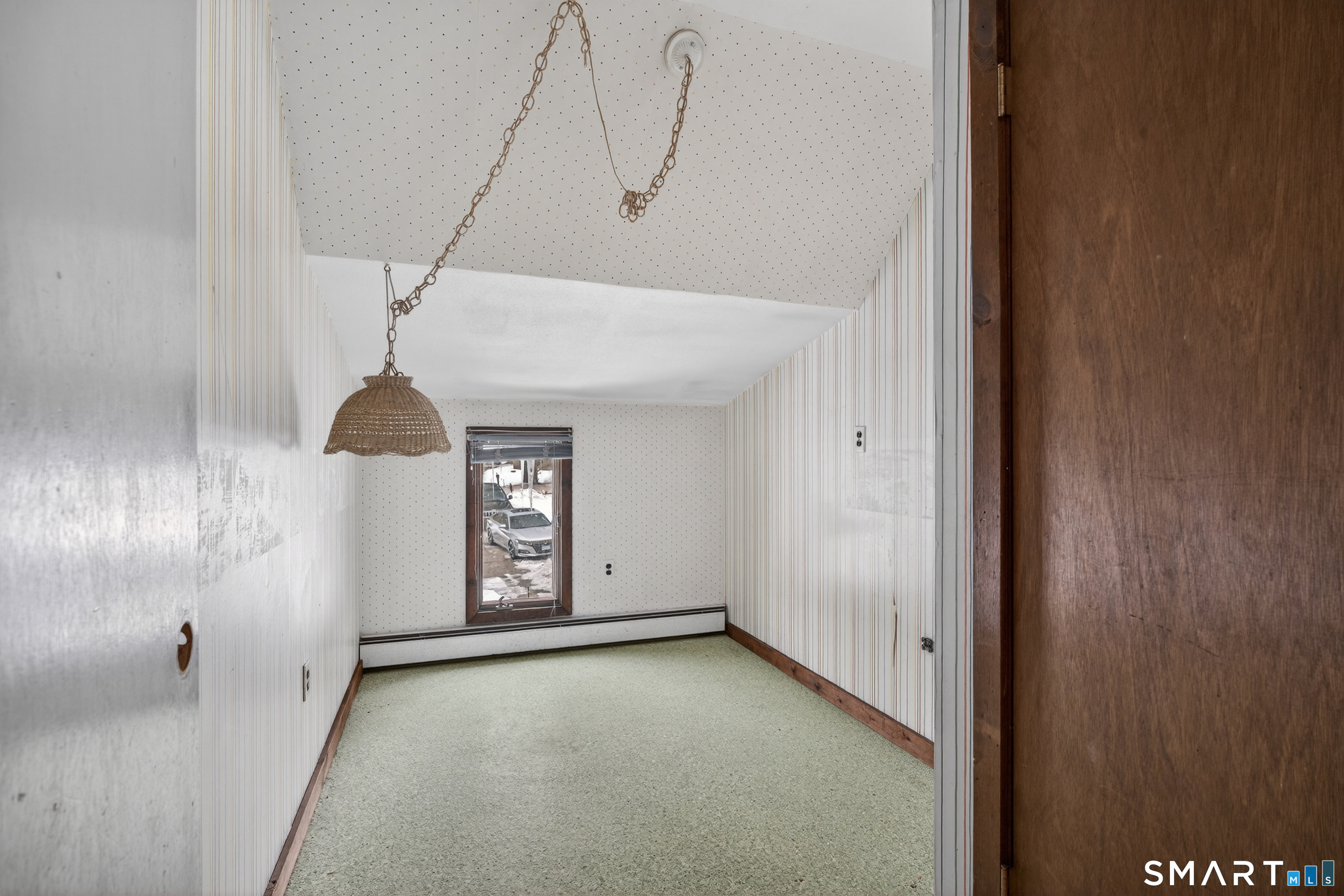 1553 Glasgo Road Griswold, CT 06351 - Photo 12 of 37 a view of an empty room with a window