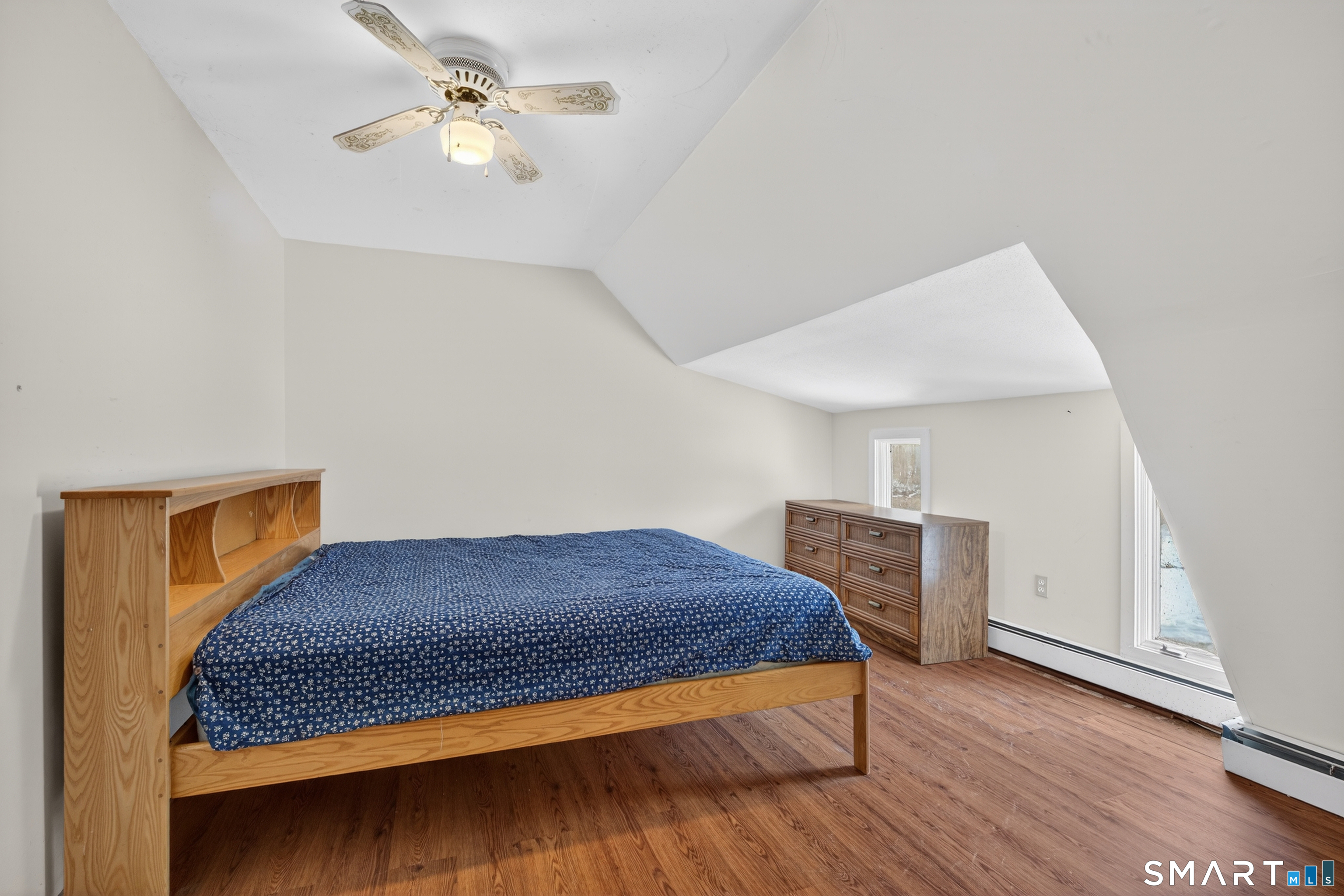 1553 Glasgo Road Griswold, CT 06351 - Photo 12 of 37 a bedroom with a bed and a chandelier