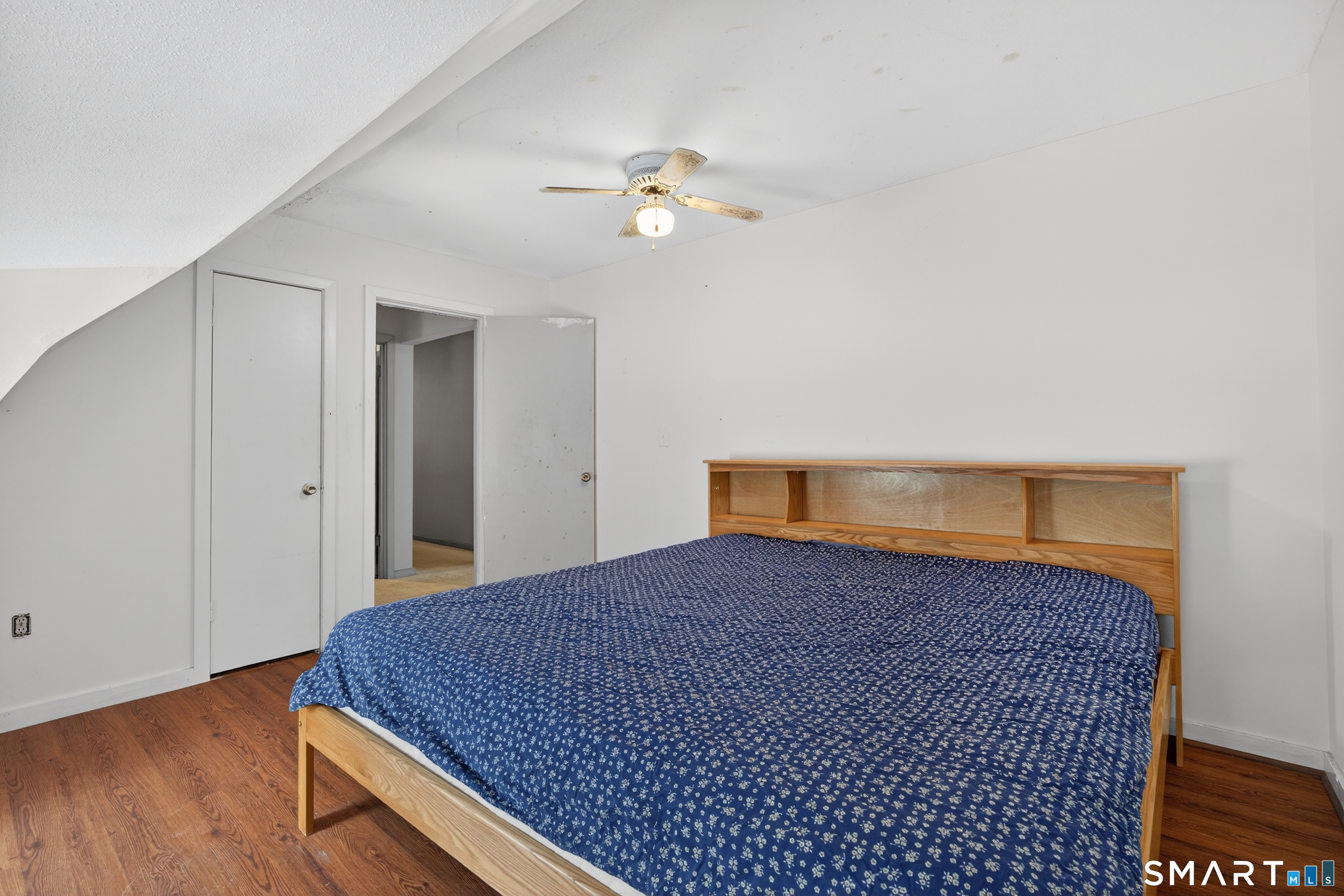 1553 Glasgo Road Griswold, CT 06351 - Photo 13 of 37 a bedroom with a bed and wooden floor