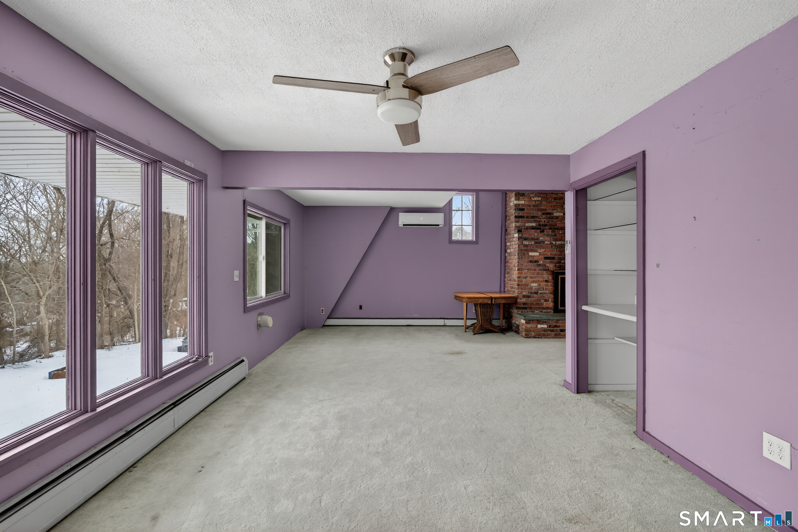 1553 Glasgo Road Griswold, CT 06351 - Photo 19 of 37 a big room with closet and a ceiling fan
