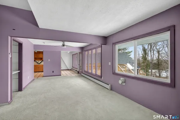 a living room with furniture and a window