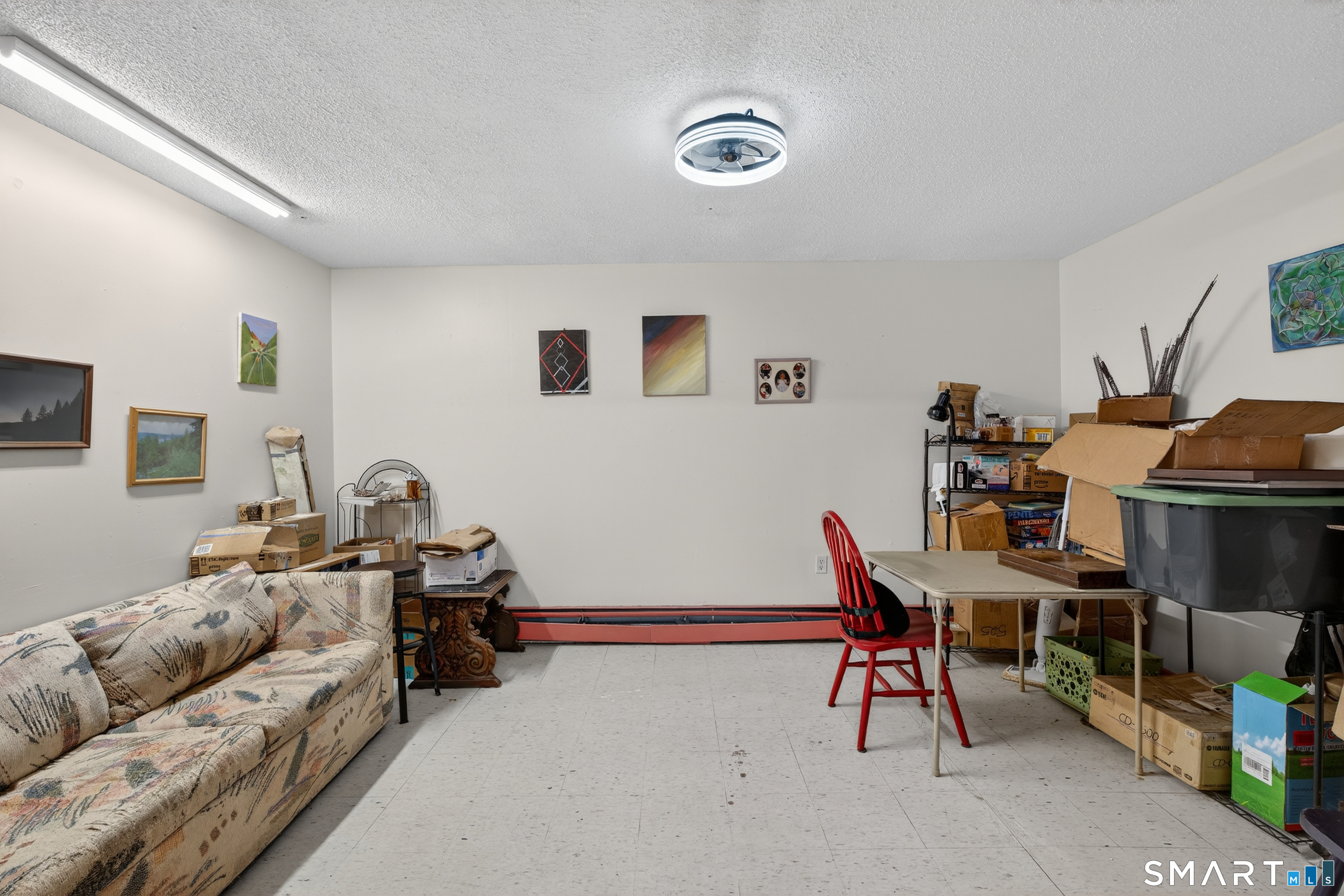 1553 Glasgo Road Griswold, CT 06351 - Photo 26 of 37 a living room with furniture and a flat screen tv