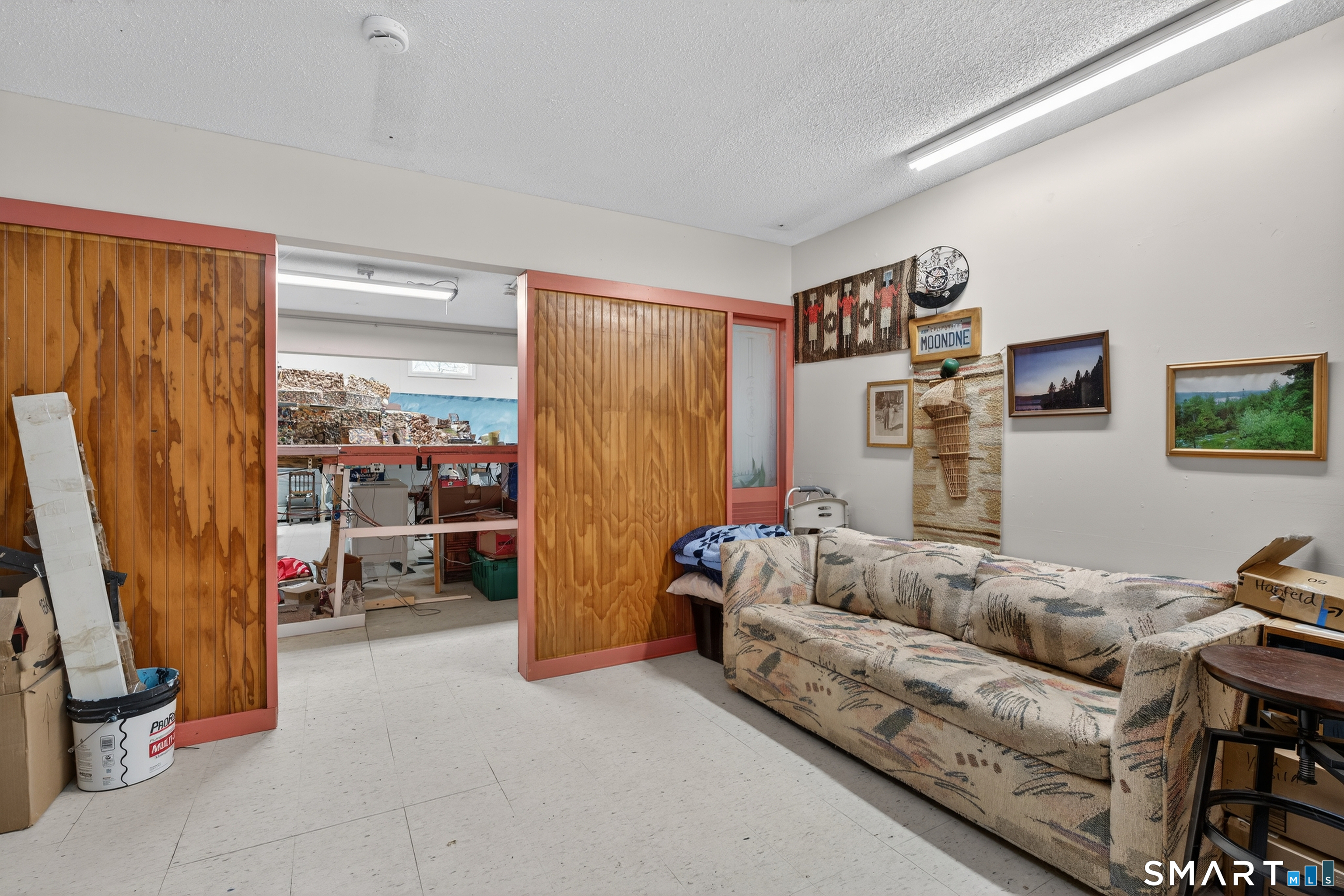 1553 Glasgo Road Griswold, CT 06351 - Photo 27 of 37 a living room with furniture and a flat screen tv