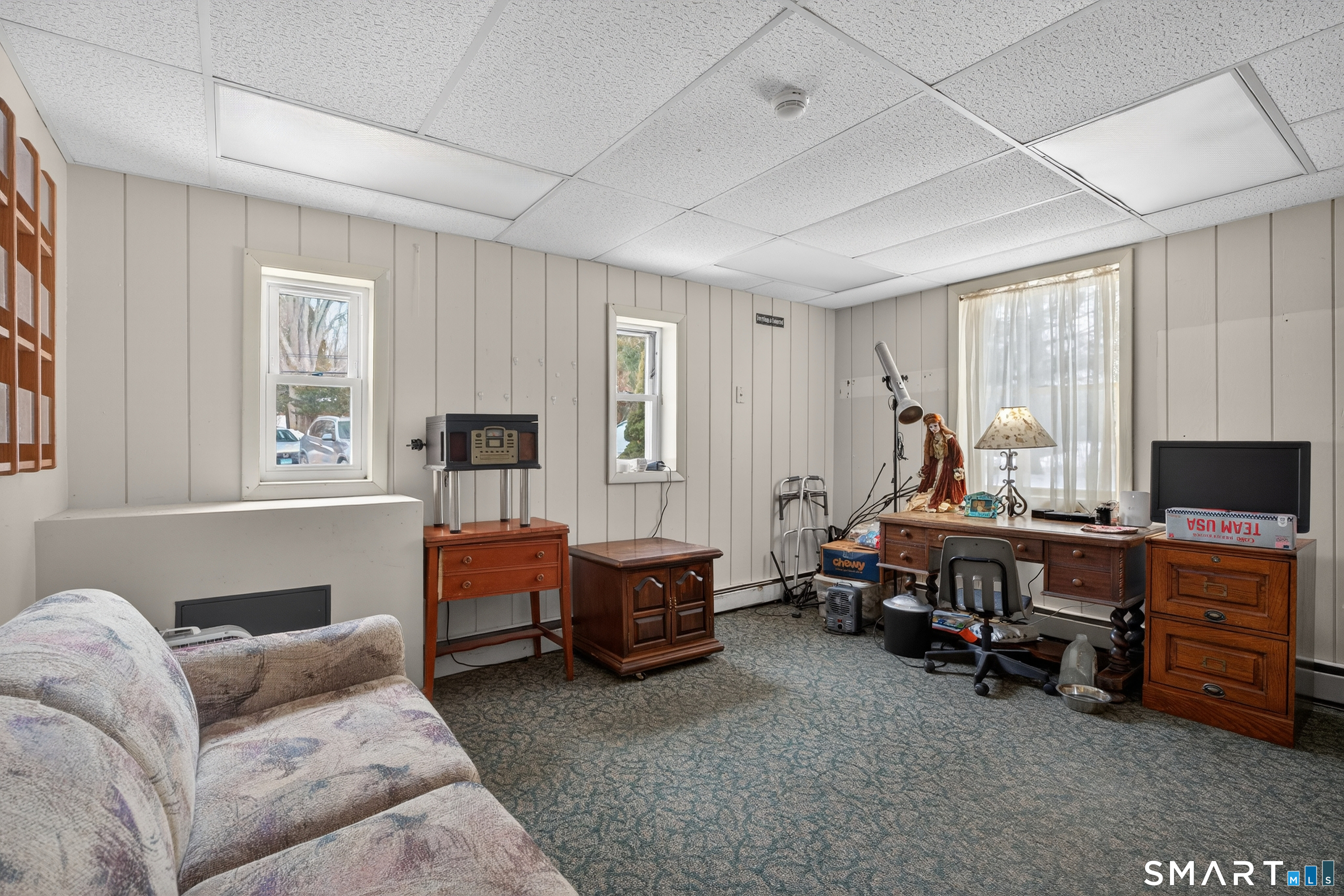 1553 Glasgo Road Griswold, CT 06351 - Photo 28 of 37 a living room with furniture and a window