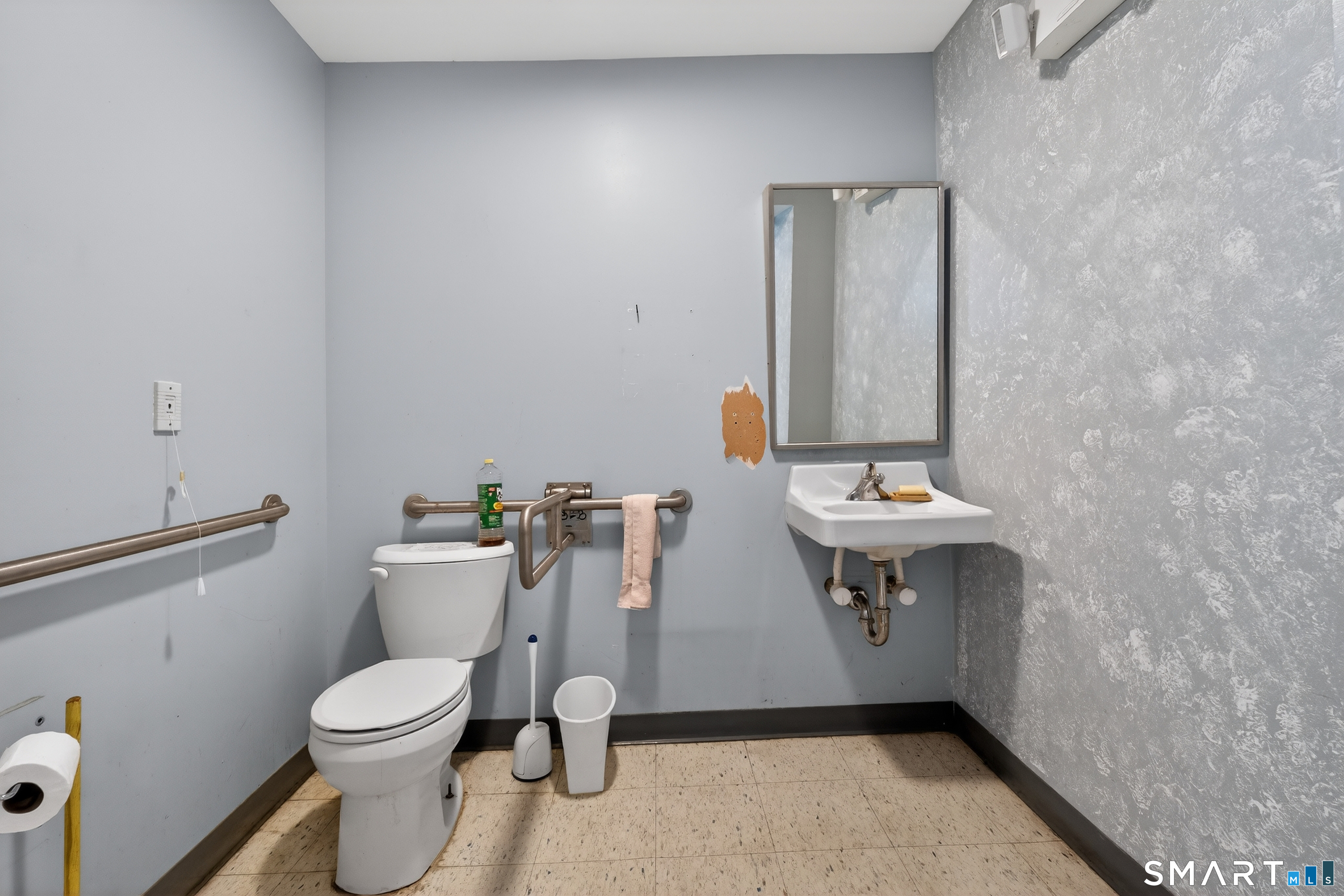 1553 Glasgo Road Griswold, CT 06351 - Photo 29 of 37 a bathroom with a toilet sink and mirror