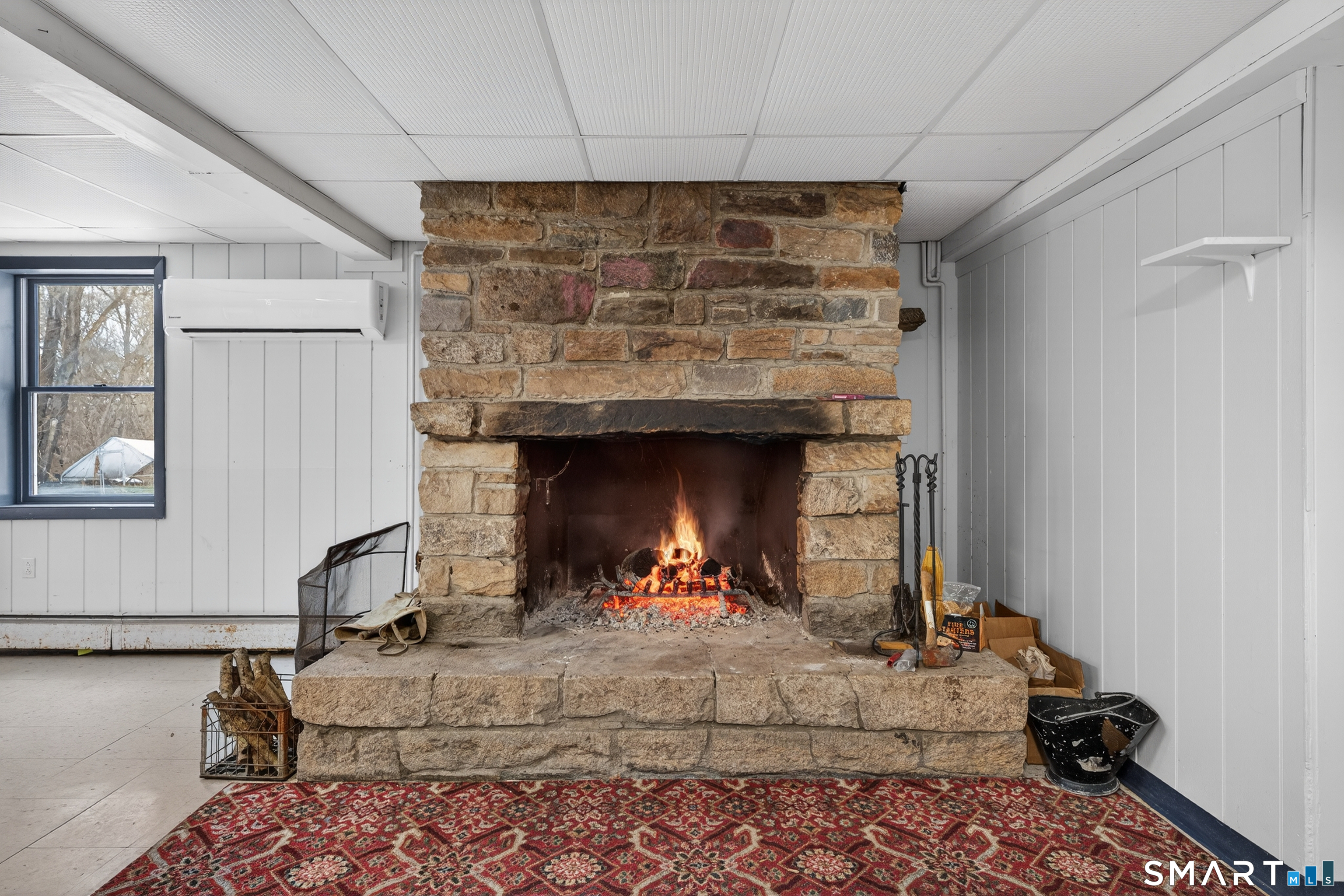 1553 Glasgo Road Griswold, CT 06351 - Photo 3 of 37 a living room with furniture and a fireplace