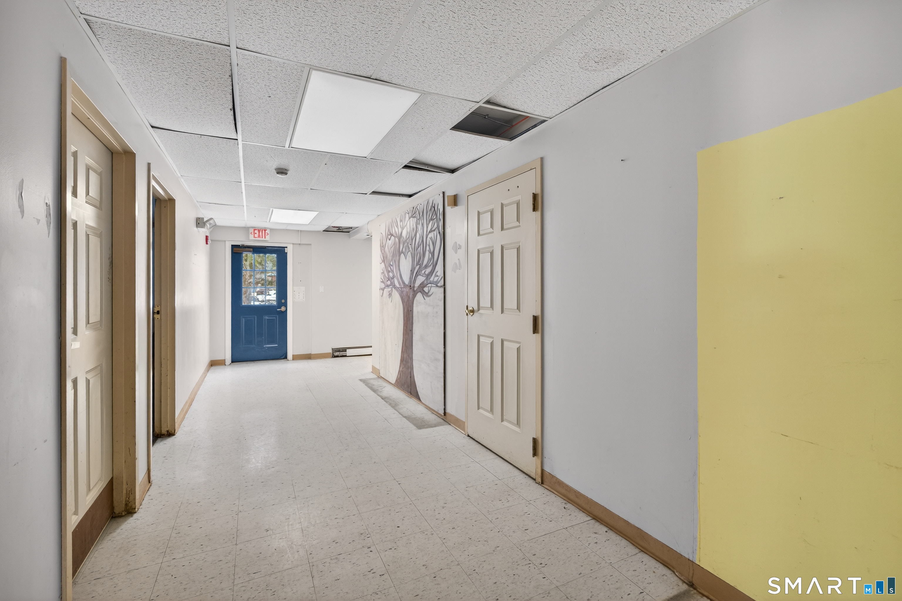 1553 Glasgo Road Griswold, CT 06351 - Photo 32 of 37 a view of a hallway with wooden shelves
