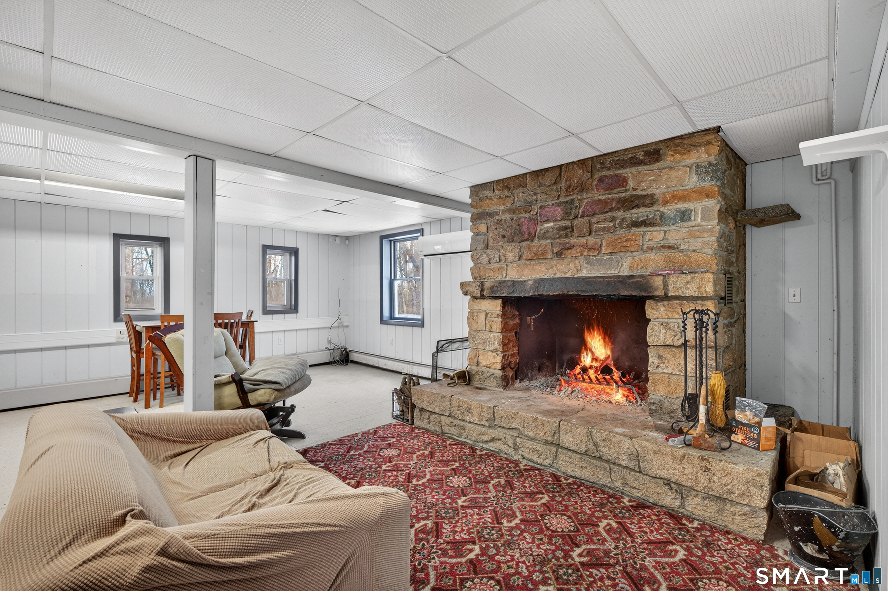 1553 Glasgo Road Griswold, CT 06351 - Photo 4 of 37 a living room with furniture and a fireplace