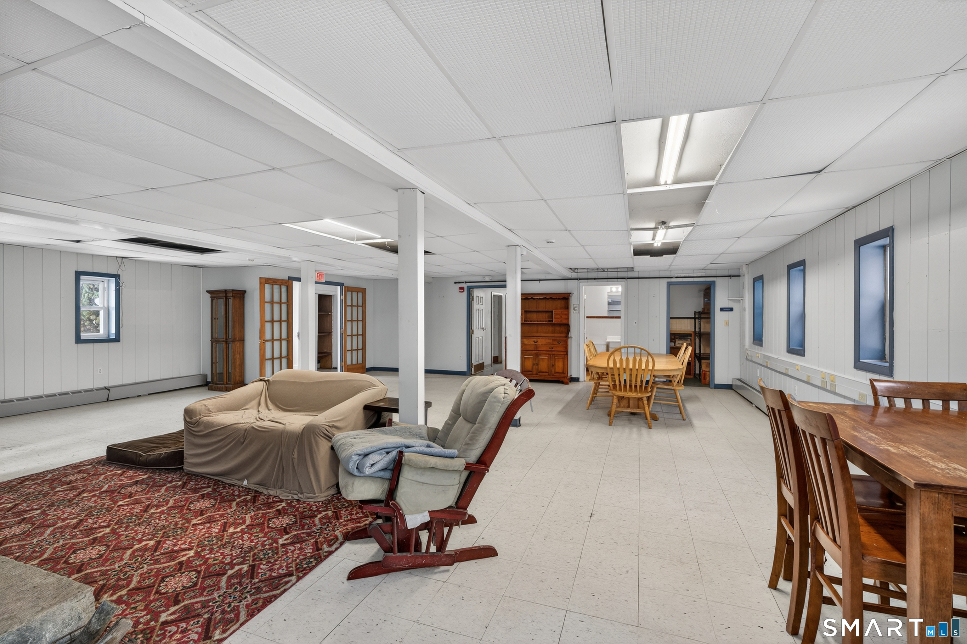 1553 Glasgo Road Griswold, CT 06351 - Photo 7 of 37 a living room with furniture and a table