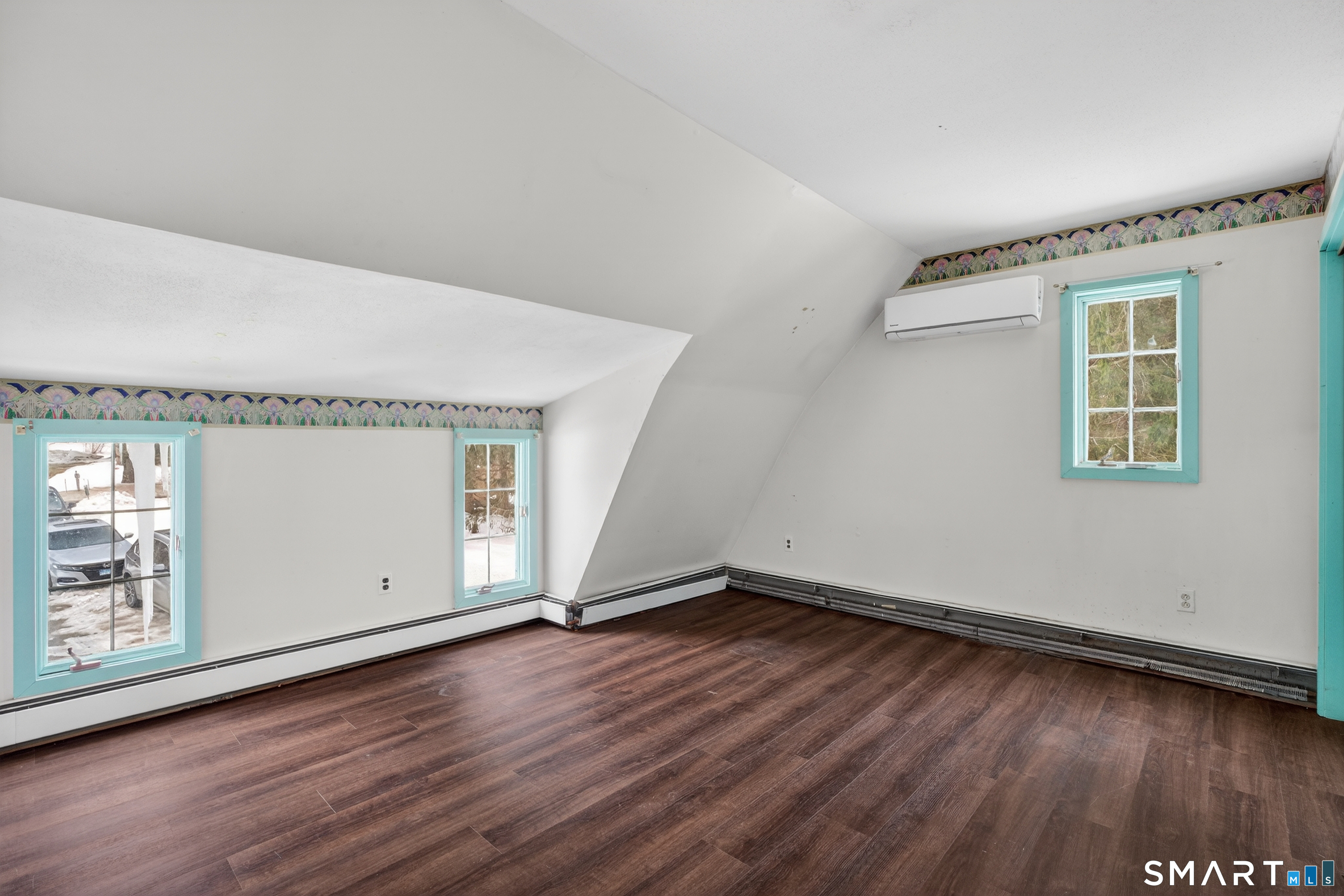 1553 Glasgo Road Griswold, CT 06351 - Photo 10 of 37 an empty room with wooden floor and windows