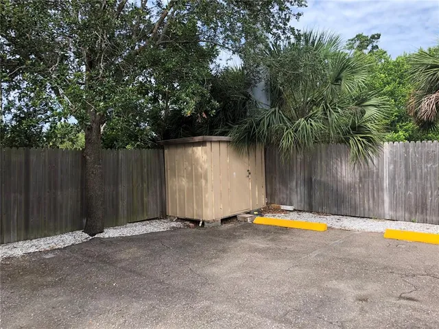 a kitchen with a sink a refrigerator and window