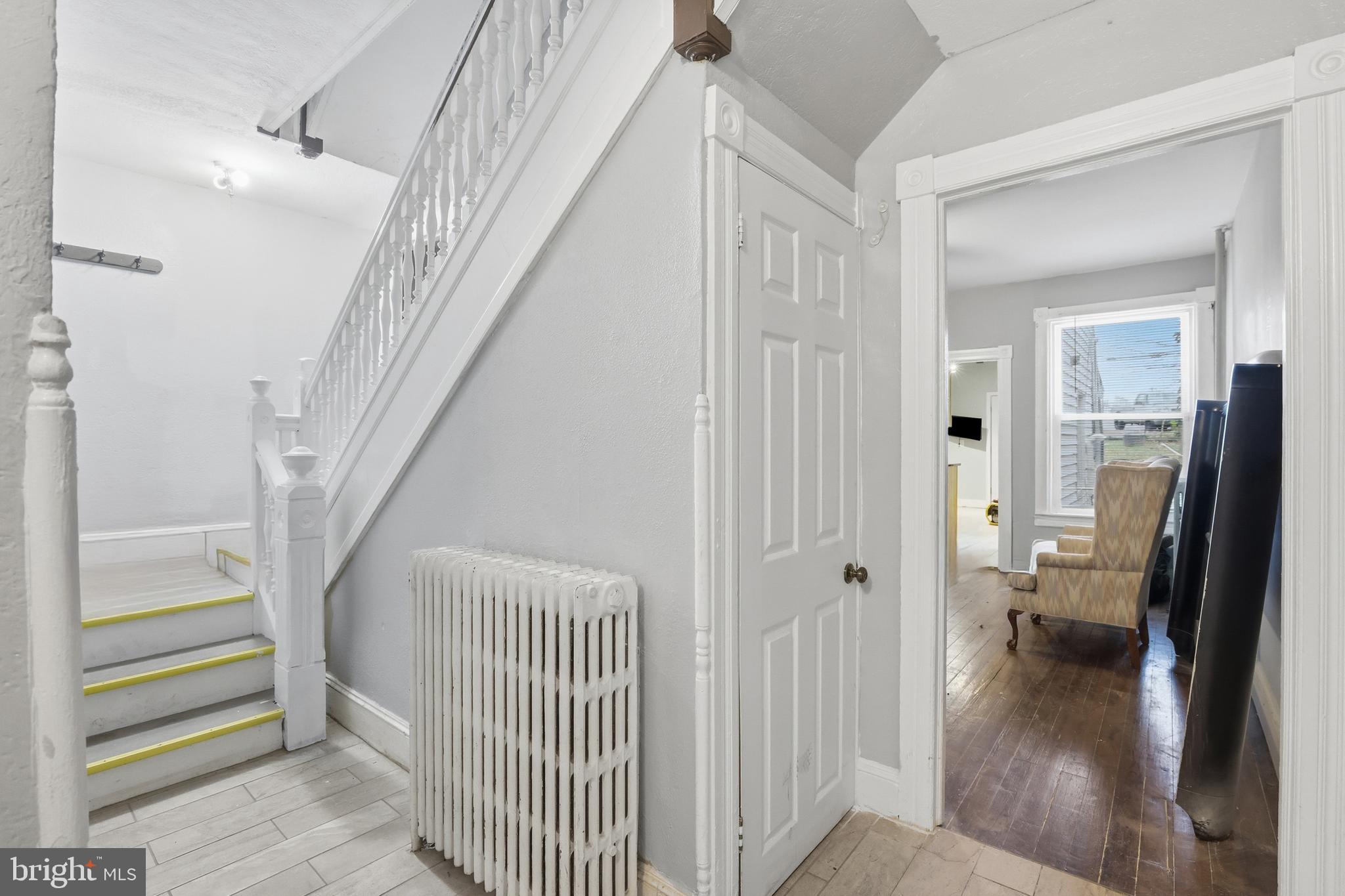 100 West Main Street Westminster, MD 21157 - Photo 11 of 26 a view of a hallway view with wooden floor and staircase