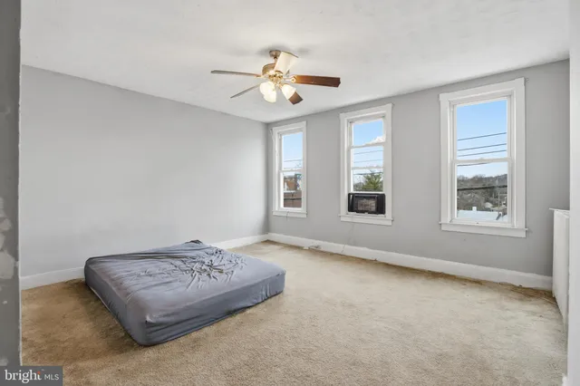 a living room with couch and window