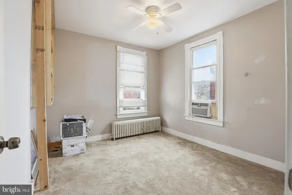 a view of livingroom with furniture and windows