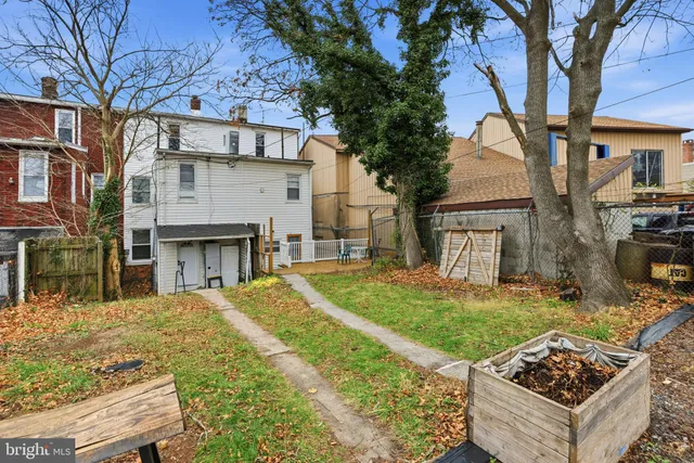 a view of a front of a house with a yard