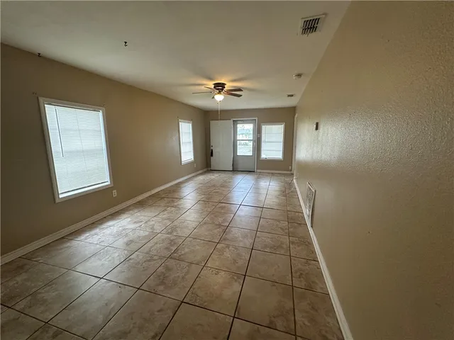 a view of hallway with windows