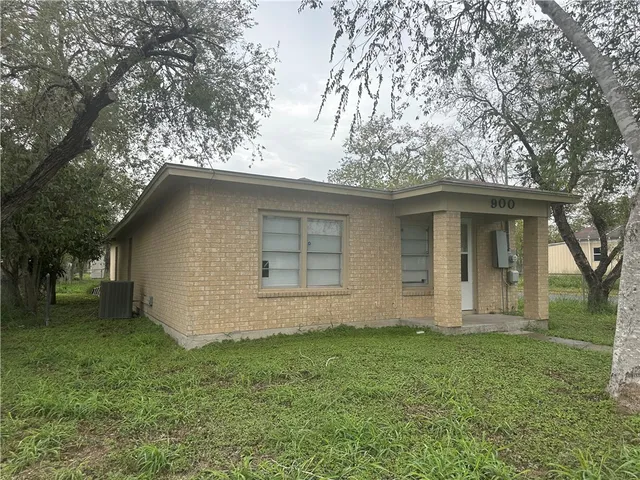 a house with garden in front of it