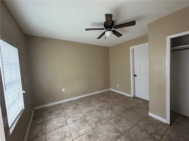 a view of an empty room and window