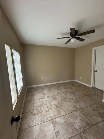 a view of an empty room and window