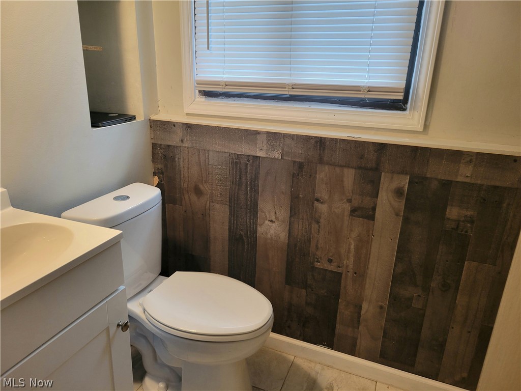 4895 Lear Nagle Road North Ridgeville, OH 44039 - Photo 12 of 27 Bathroom with tile flooring, vanity, and toilet