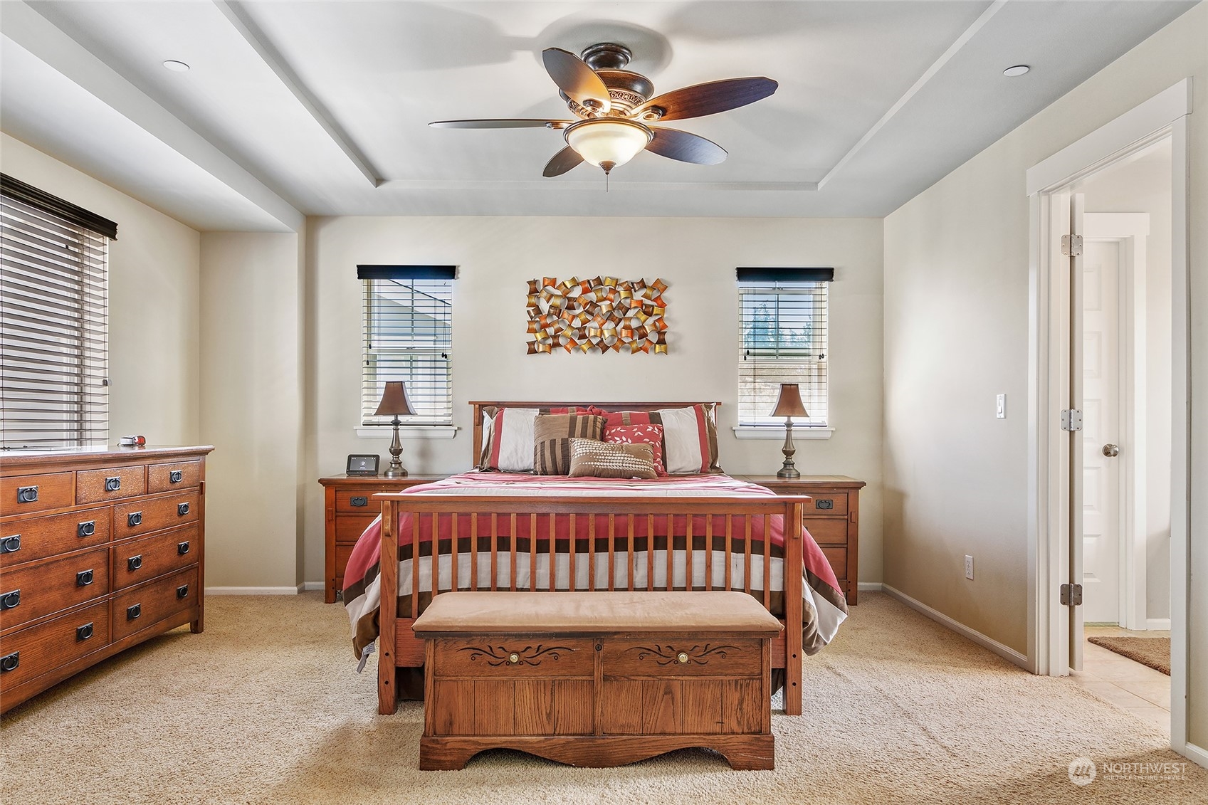 18316 35th Drive Southeast Bothell, WA 98012 - Photo 11 of 26 a bedroom with a bed and a chandelier fan