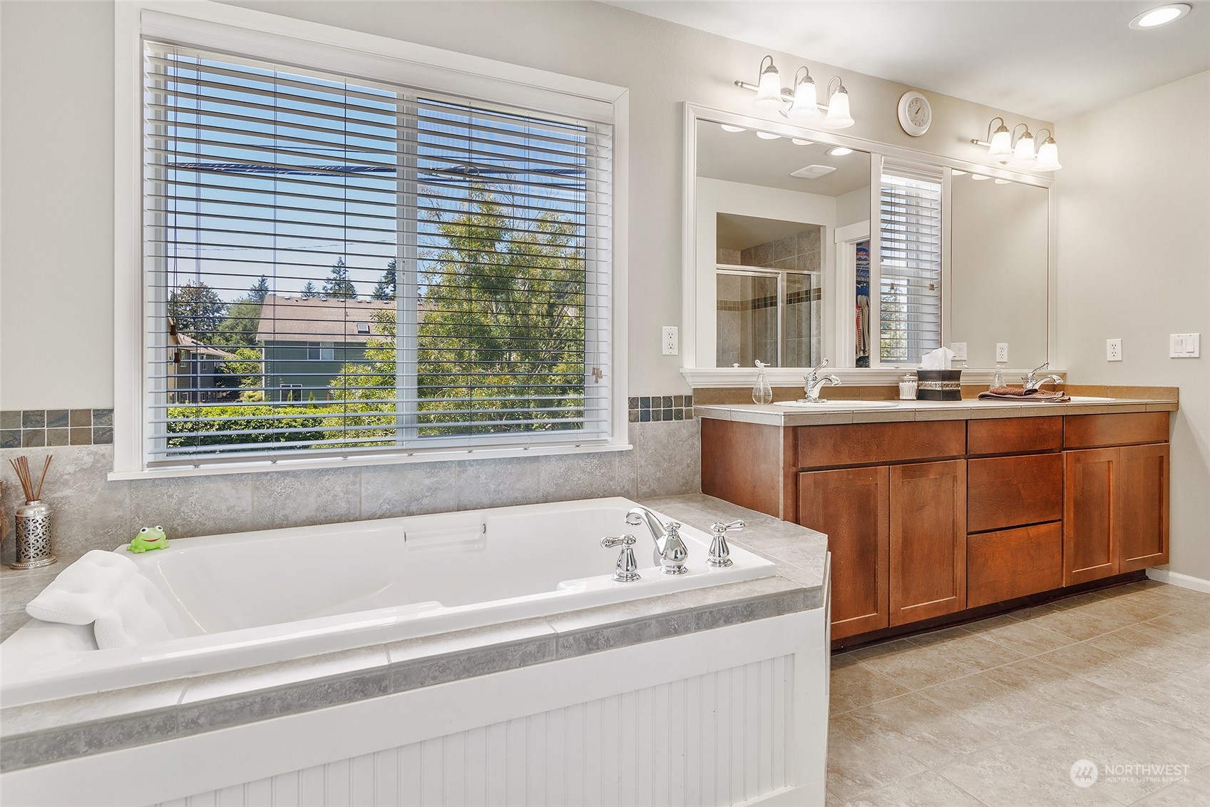 18316 35th Drive Southeast Bothell, WA 98012 - Photo 15 of 26 a bathroom with a bathtub sink and mirror