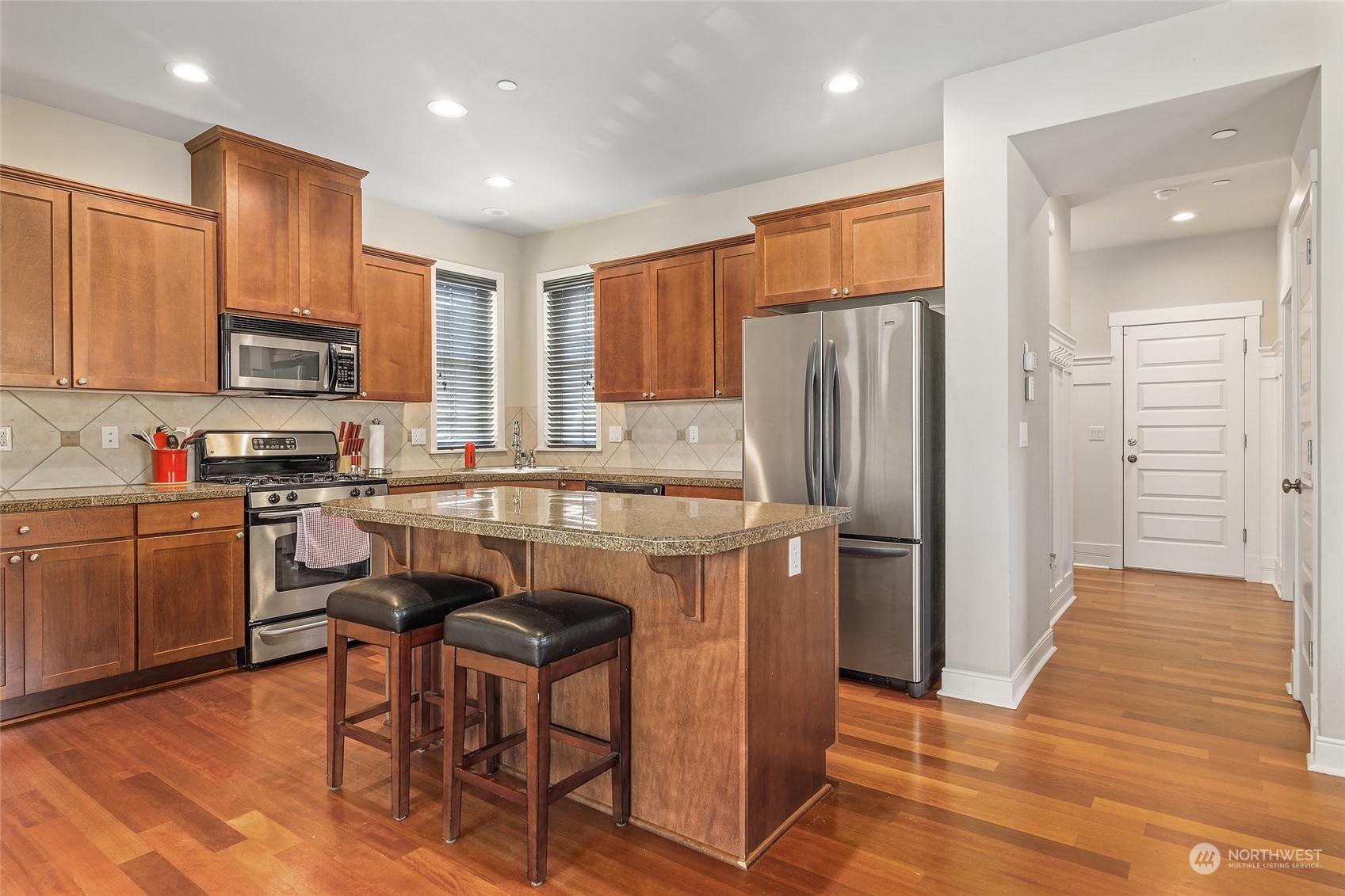 18316 35th Drive Southeast Bothell, WA 98012 - Photo 2 of 26 a kitchen with stainless steel appliances granite countertop a refrigerator stove microwave and sink