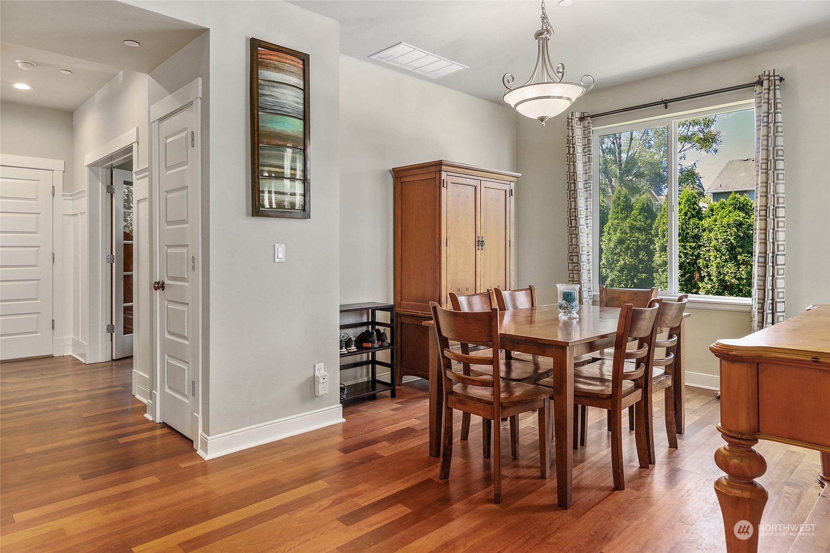 18316 35th Drive Southeast Bothell, WA 98012 - Photo 7 of 26 a view of a dining room with furniture window and wooden floor