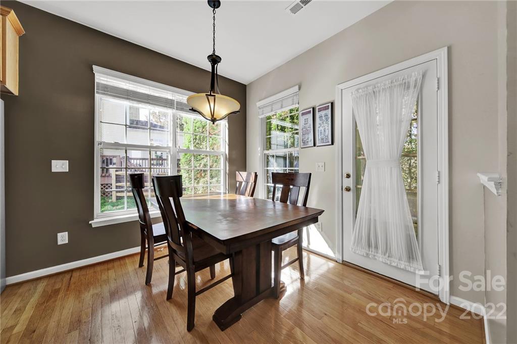 1640 Spandril Lane Fort Mill, SC 29708 - Photo 13 of 48 a view of a dining room with furniture window and wooden floor