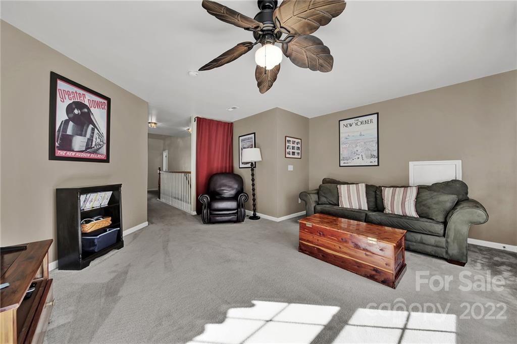 1640 Spandril Lane Fort Mill, SC 29708 - Photo 33 of 48 a bedroom with furniture and a fireplace