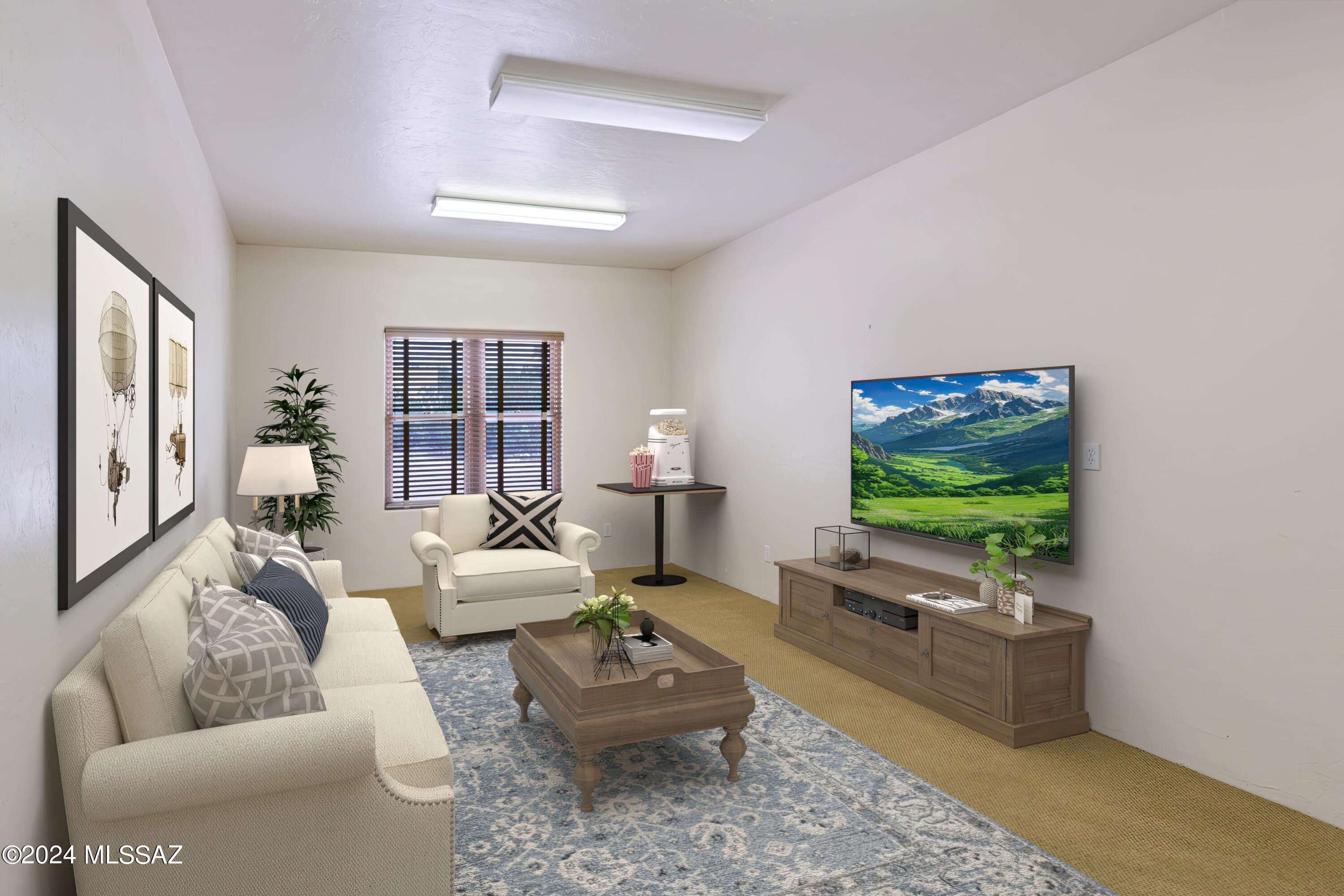 4001 North Harrison Road Tucson, AZ 85749 - Photo 35 of 50 a living room with furniture and a flat screen tv