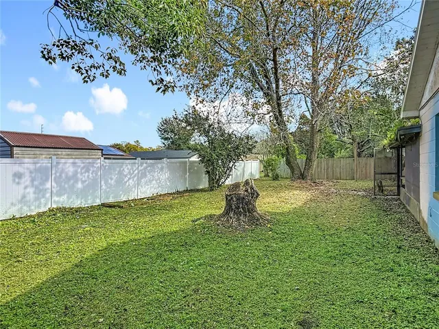a backyard of a house with lots of green space