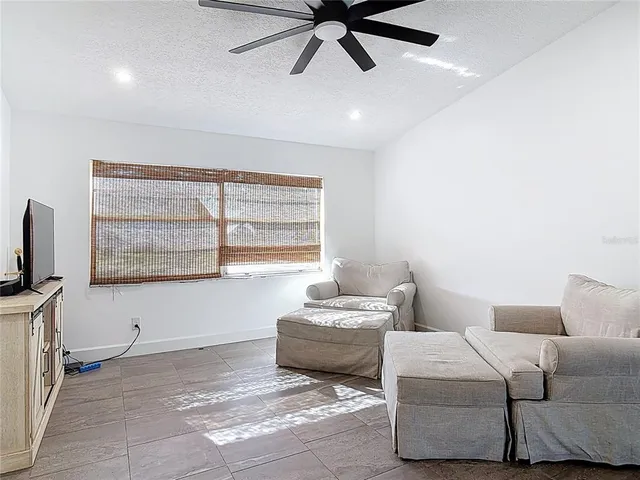 a living room with furniture and a window