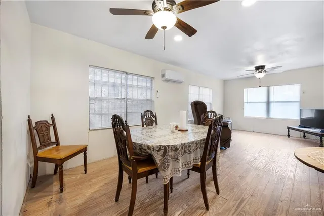 a view of a dining room with furniture and window