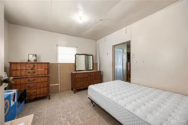 a bedroom with a bed and cabinets