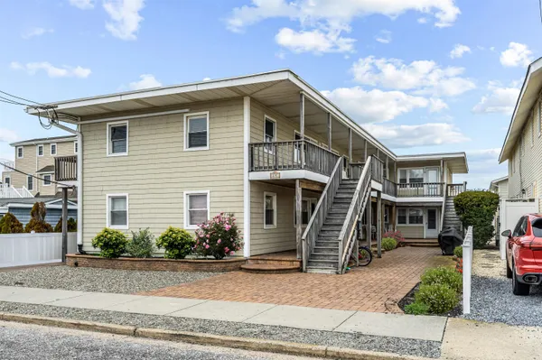a front view of a house with garage