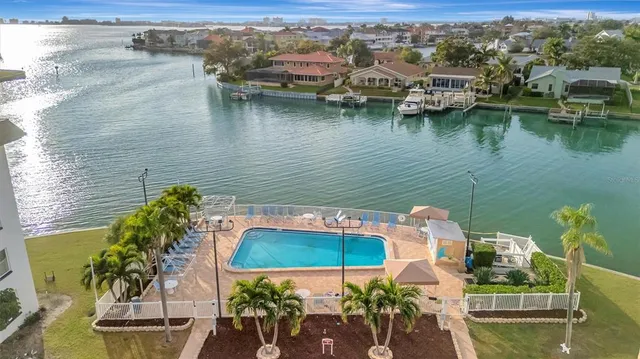 an aerial view of a house with a lake view