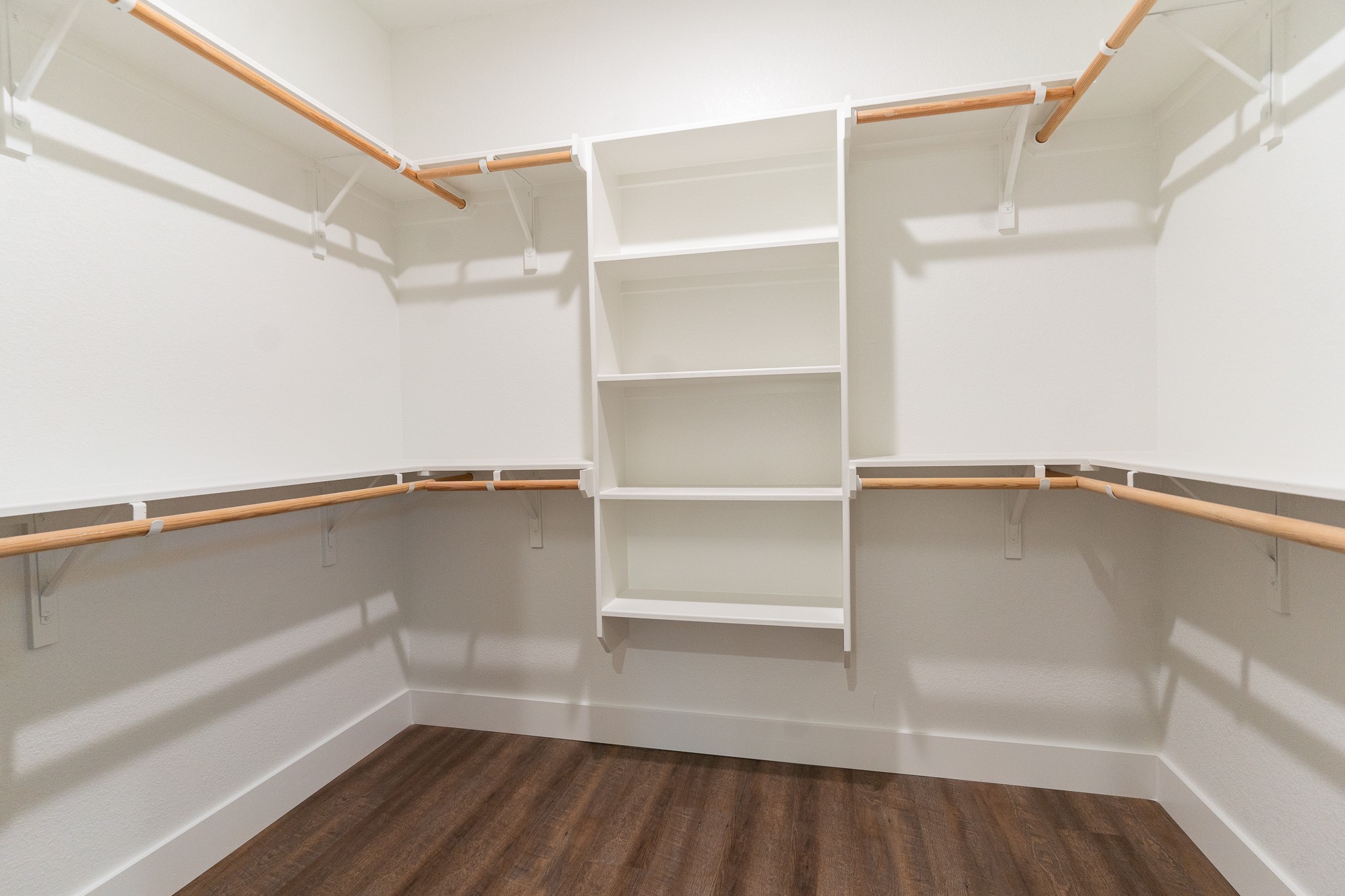 304 String Prairie Way Smithville, TX 78957 - Photo 17 of 30 Spacious closet with dark wood finished floors