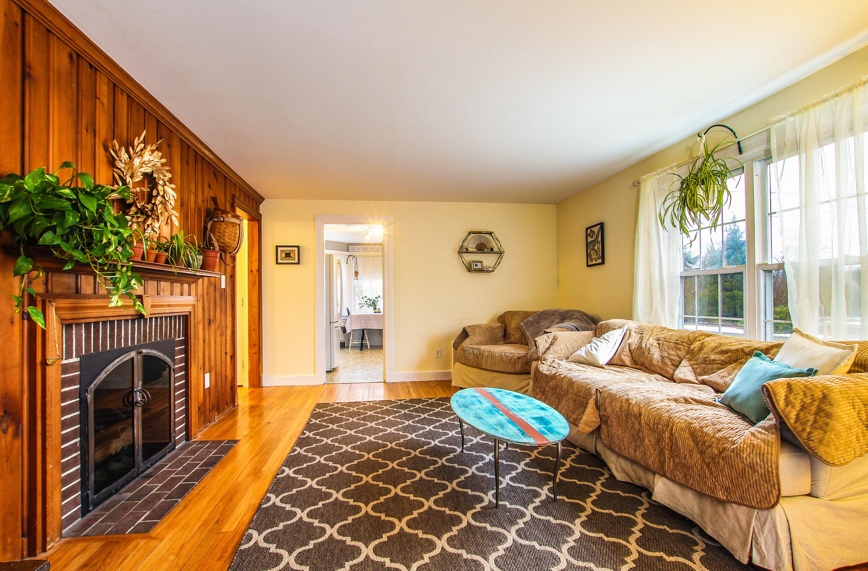42 Circle Drive Hyannis, MA 02601 - Photo 4 of 25 a living room with furniture a fireplace and a large window
