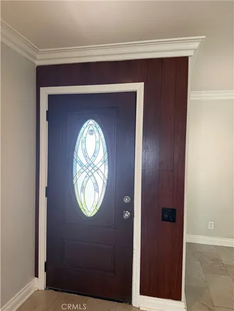 a view of a room with wooden floor and a balcony